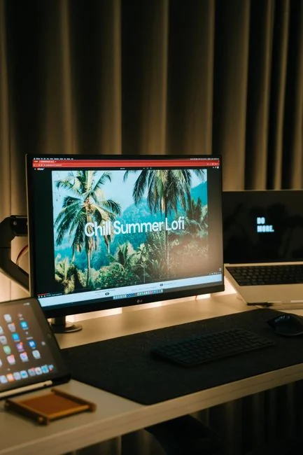 why-choose-us Business desk with laptop, coffee, and water glass, showcasing modern technology and productivity.